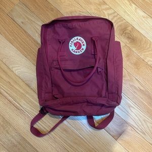 Fjallraven kanken burgundy 13 inch laptop backpack.